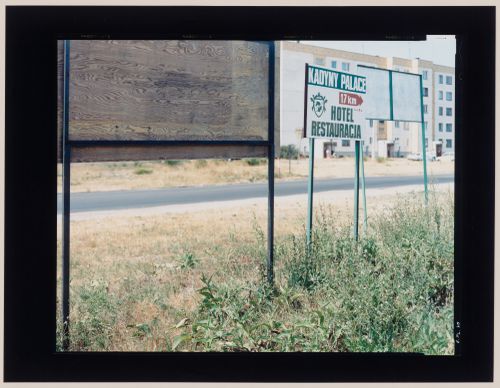 View of signs, a road and apartment buildings, Jastrowie, Poland (from the series "In between cities")