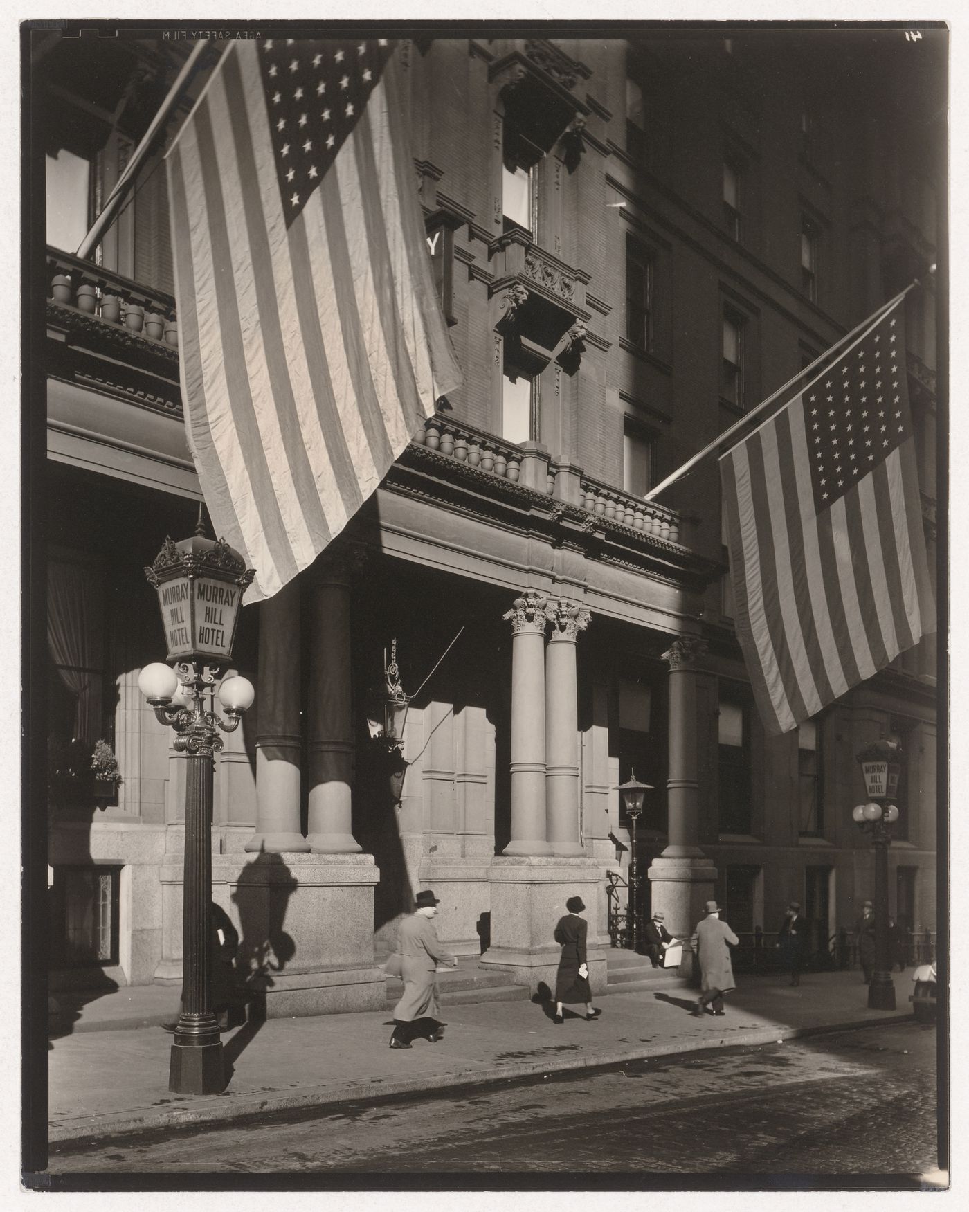 112 Park Avenue Murray Hill Hotel street scene with two American flags flying, New York City, New York