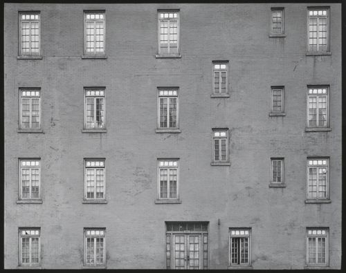 Building façade: abstract view of windows, door of building, New York