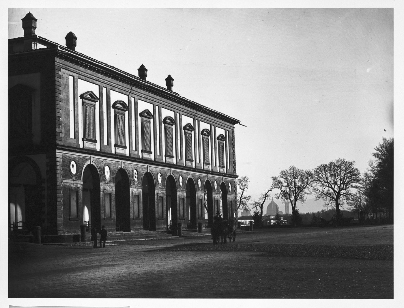 Palazzo Delle Cascine, view of southern façade with figures and horse carriage out front, Florence, Italy