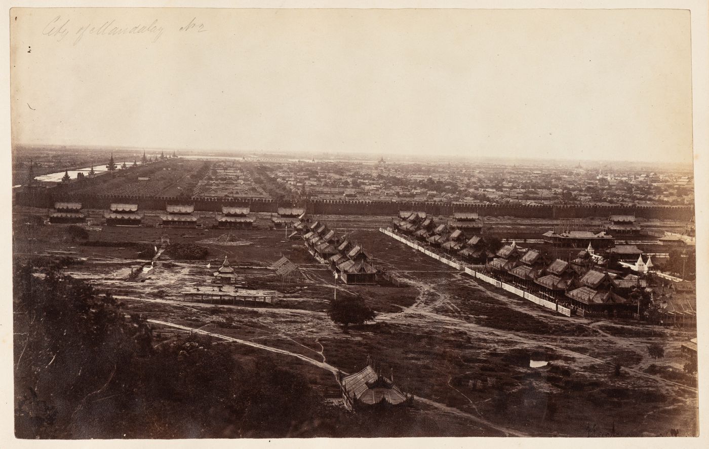 View of Mandalay showing the city wall, moat, and buildings, from Mandalay Hill, Burma (now Myanmar)
