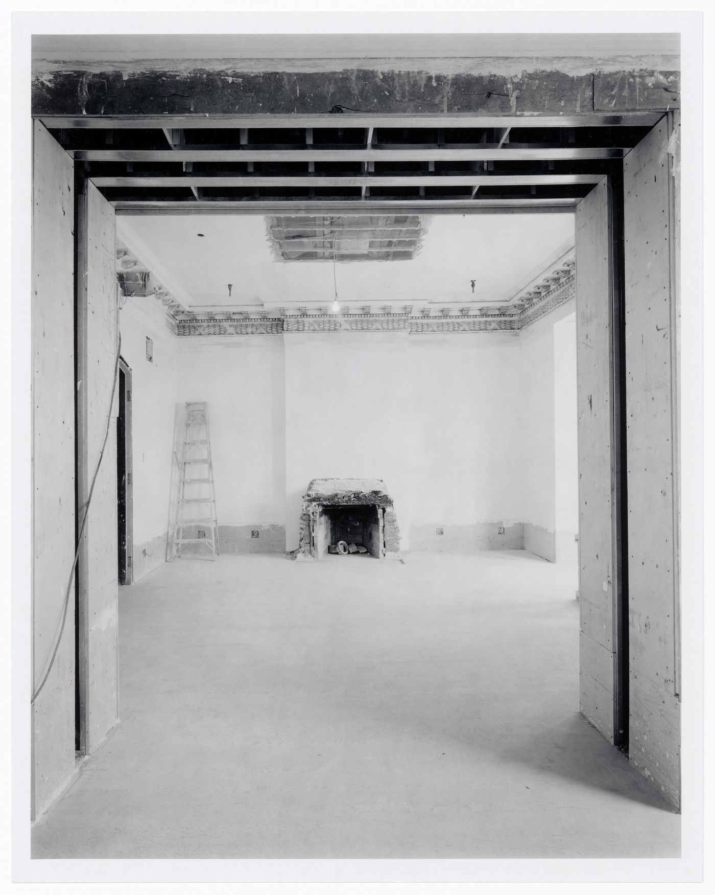 Interior view of the Founders' Room showing the fireplace, Shaughnessy House under renovation, Montréal, Québec