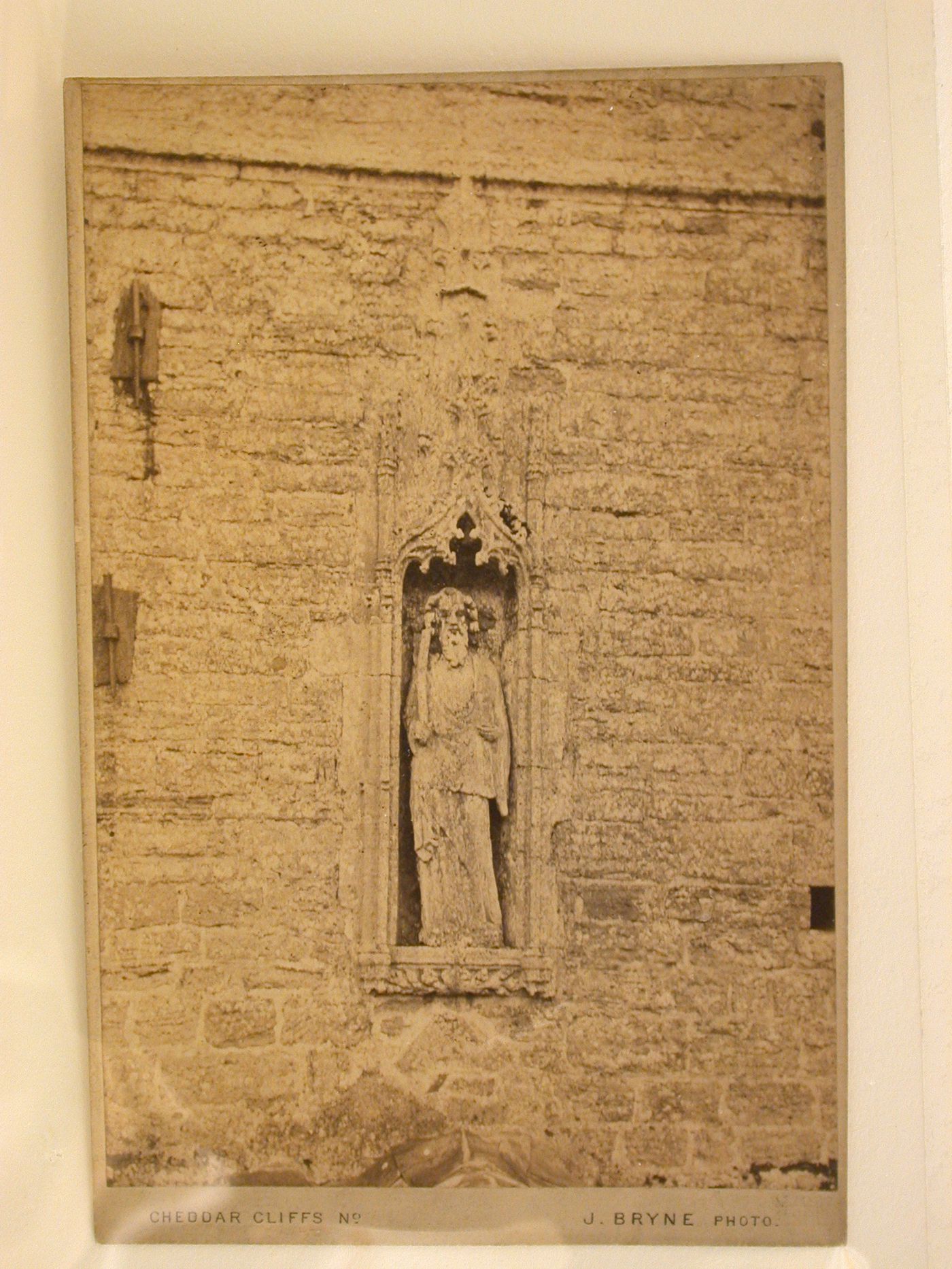 View of a statue in a niche, probably at the Church of St. Andrews, Cheddar, Somerset, England