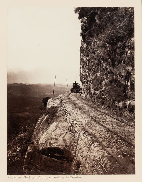 View of a locomotive on the Colombo-Kandy Railway, Sensation Rock, near Balana, Ceylon (now Sri Lanka)