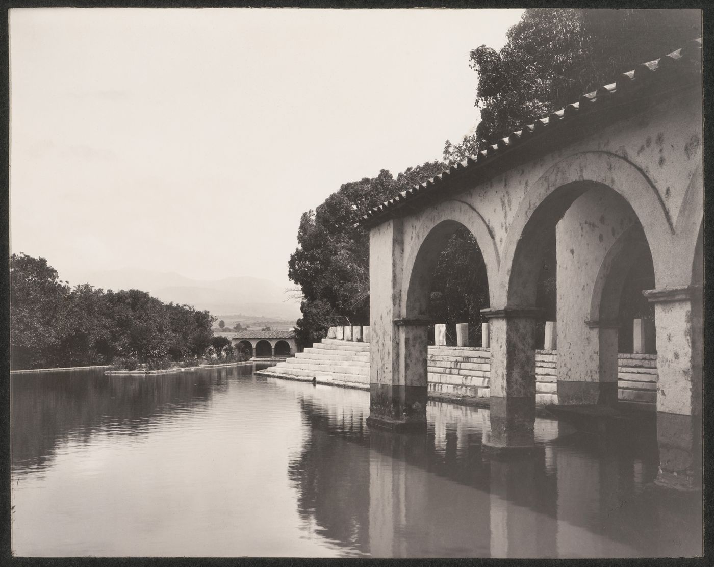 View of the Jardín Borda showing a water feature and loggias with the Volcano of Ajusco in the background, Cuernavaca, Mexico