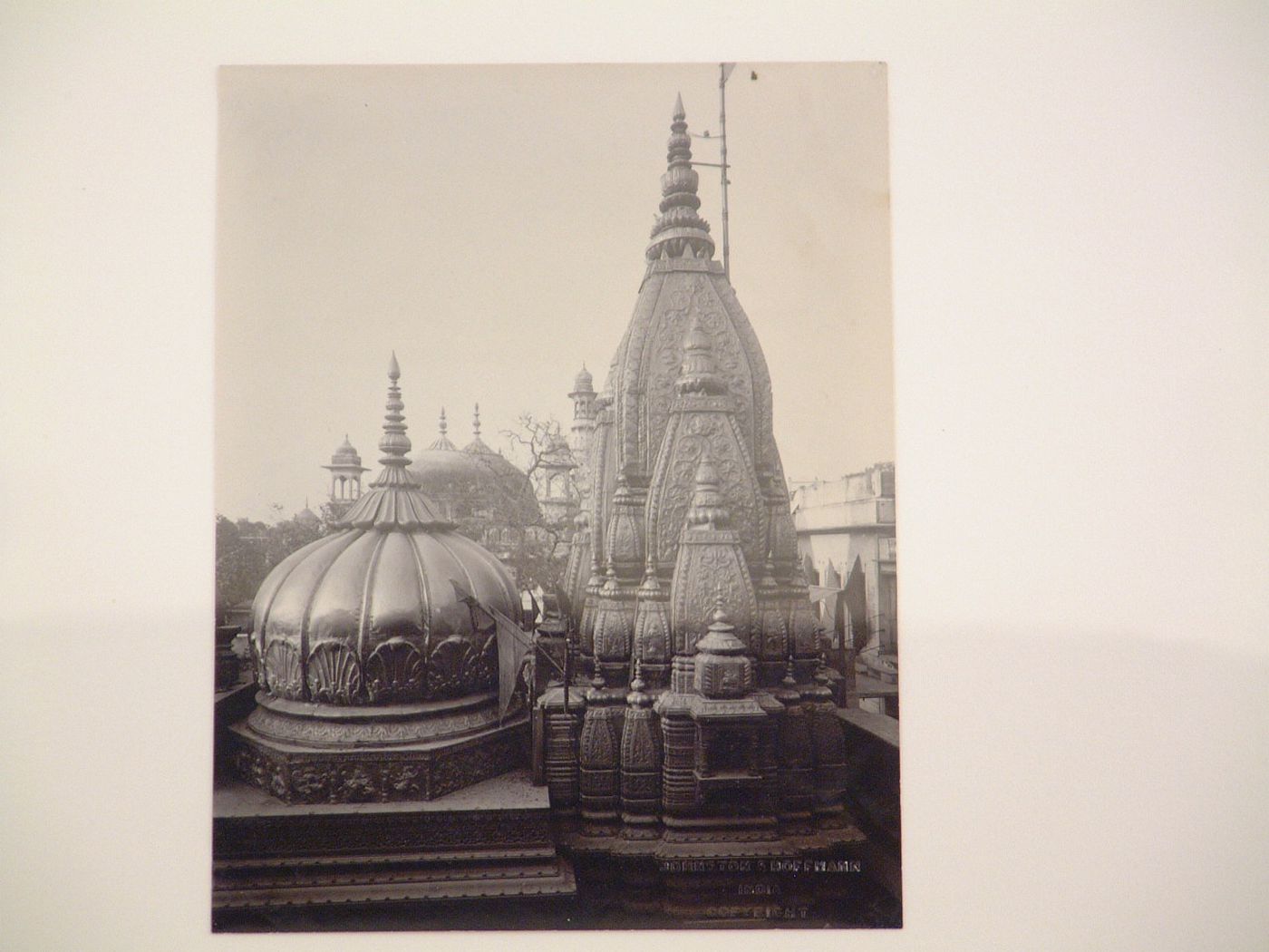 Partial view of the Vishwanath Temple (also known as the Golden Temple) showing domes and towers, Benares (now Varansi), India