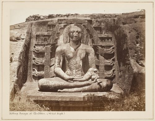 View of a meditating Buddha and a man, Gal Vihara, Polonnaruwa, Ceylon (now Sri Lanka)