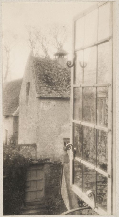 Kelmscott Manor, view from the Tapestry Room, looking through an open window into a yard, Oxfordshire, England