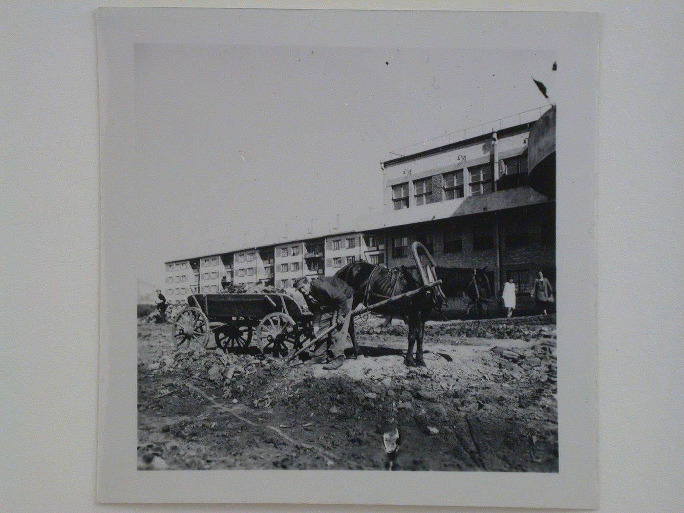 Exterior view of workers' housing and club-cafeteria (right), Kharkov Tractor Plant (KhTZ) Settlement, Kharkov, Soviet Union (now in Ukraine)