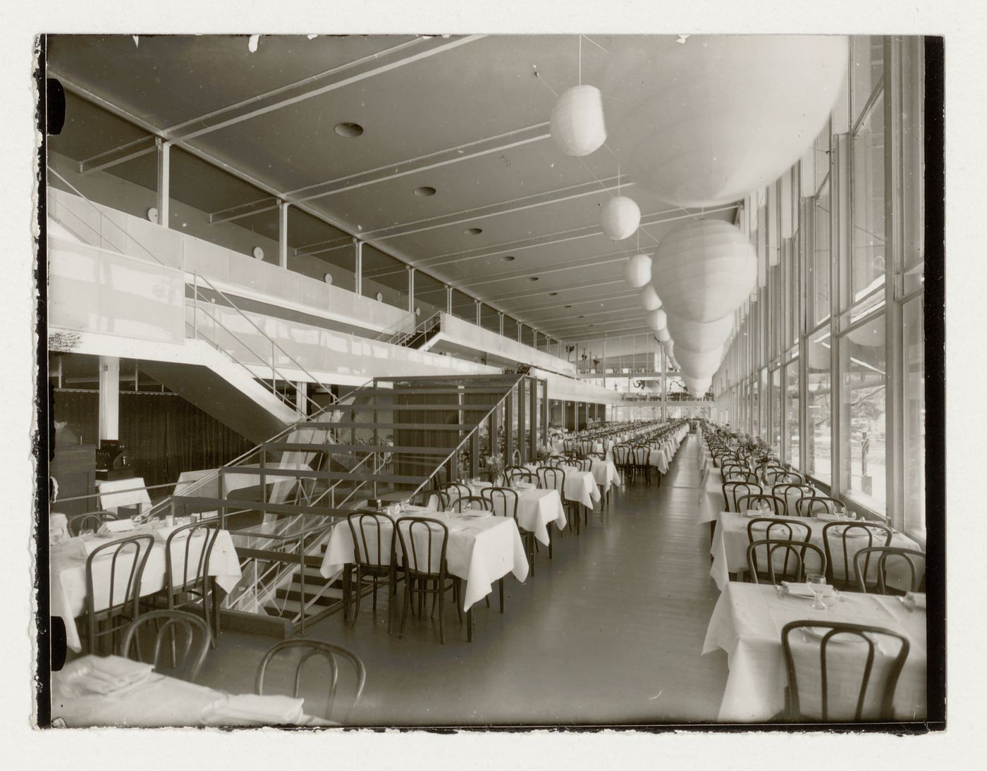Interior view of Paradise Restaurant at the Stockholm Exhibition of 1930 showing tables, chairs and ceiling fixtures, Stockholm