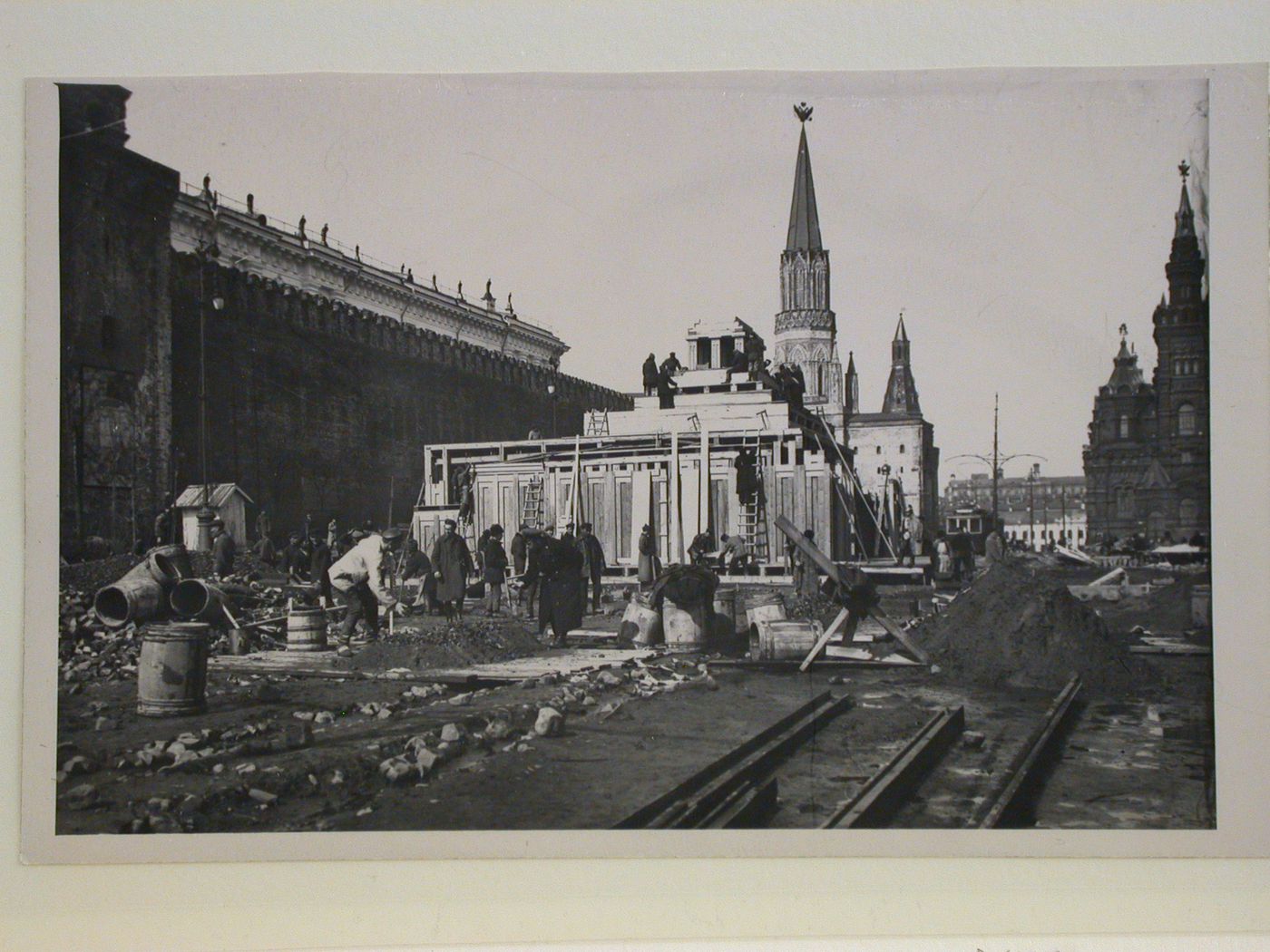 View of the lateral façade of the second wooden Lenin Mausoleum with the Nikol'skaia Tower (Nicholas Tower) and the Historical Museum in the background, Red Square, Moscow