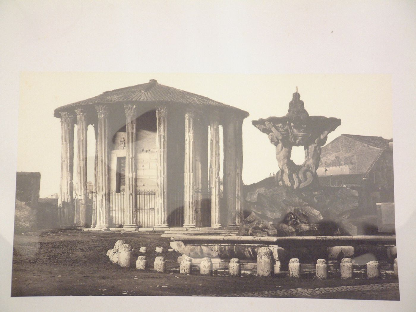 View of the Tempio di Vesta and the fountain at Santa Maria in Cosmedin, Piazza della Bocca Verità, Rome, Italy