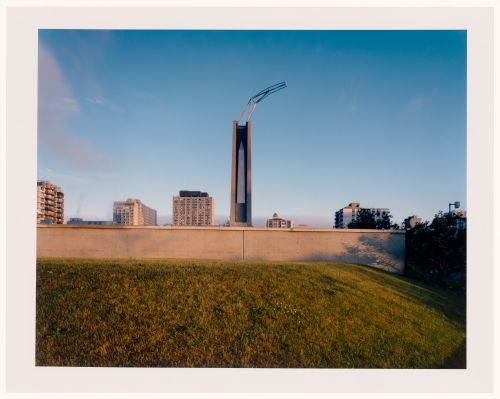 CCA Garden: View of the obelisk-chimney allegorical column from behind the Belvedere wall, Montréal, Québec, Canada