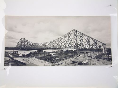 View of Kolkata tram and the Howrah Bridge over the Hooghly River, West Bengal, India
