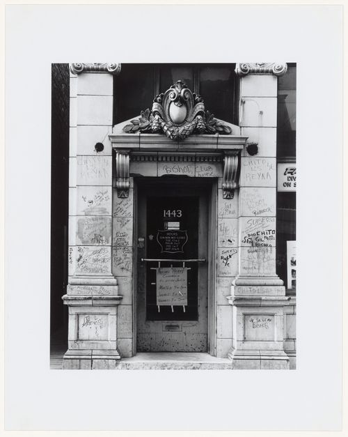 Close-up view of an ornate doorway with sculpture and graffiti, 1443 18th Street, Chicago, Illinois, United States