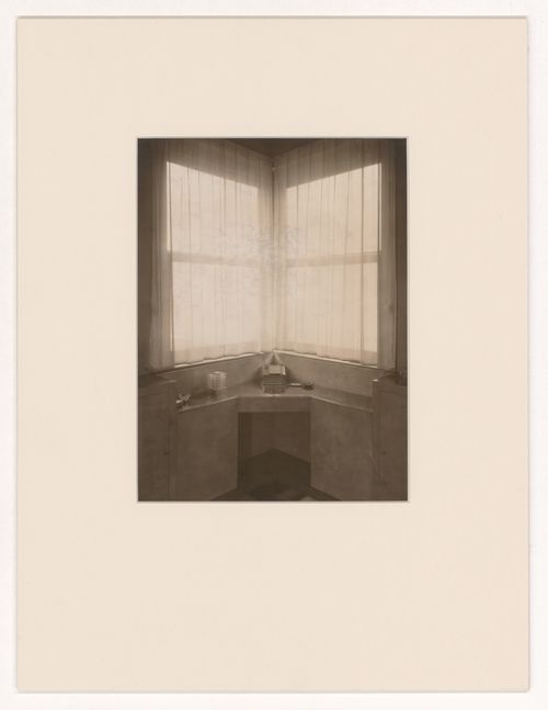 Interior view of a built-in desk in front of a window in an unidentified apartment