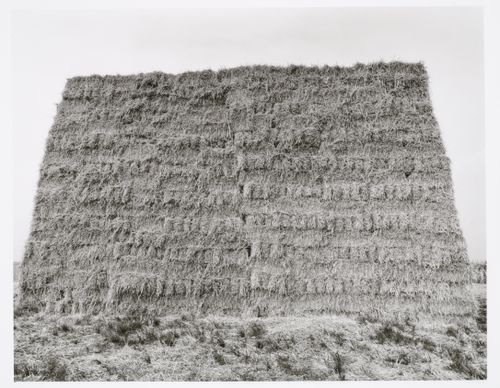 View of bales of straw stacked in the shape of a house, Mainz, Germany
