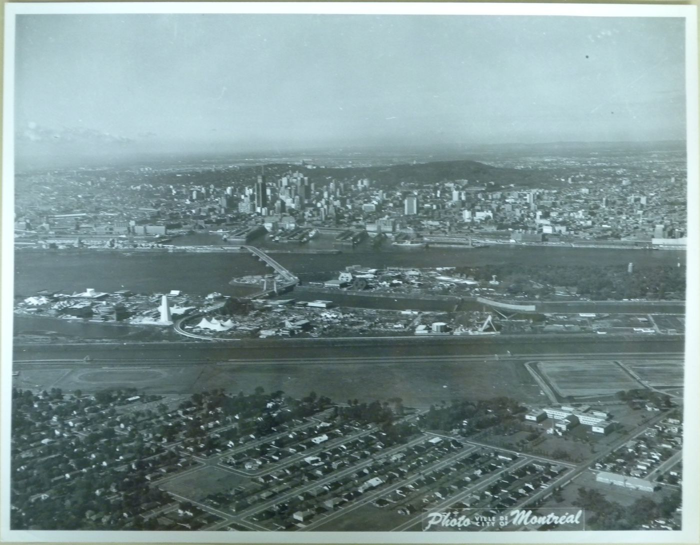 Aerial view of Montréal and of the exhibition sites, Expo 67, Montréal, Québec