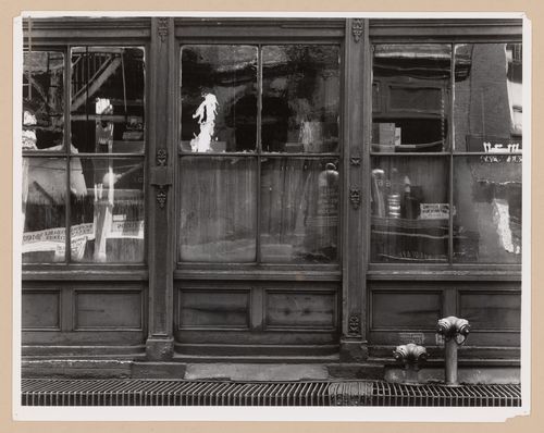 Partial view of the ground floor of a commercial building showing window reflections, Lower Manhattan, New York City, United States,