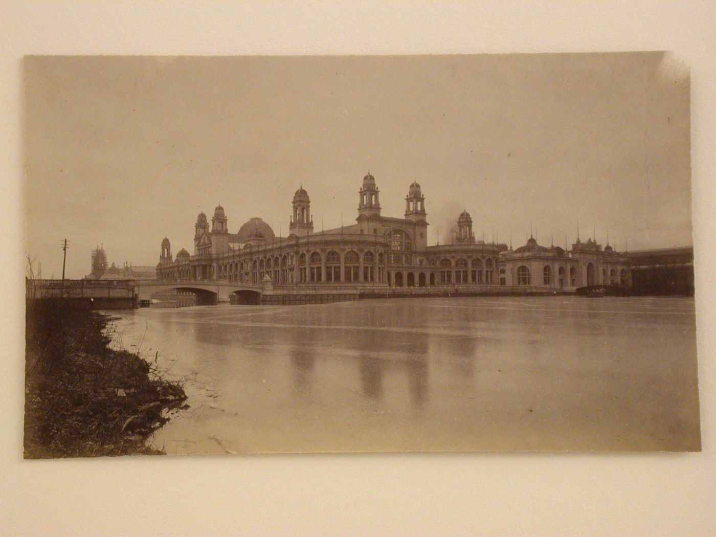 View of the north and east façades of the Electricity Building from the east bank of the Lagoon with the Mines and Mining Building in the background, 1893 Chicago World's Columbian Exhibition, Chicago, Illinois
