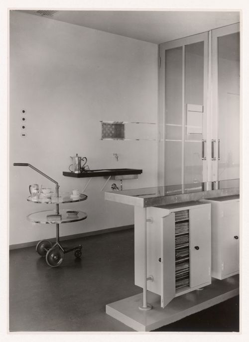 Interior view of the lounge of Villa Allegonda showing a built-in counter and bar designed by J.J.P. Oud and a tea wagon, Katwijk aan Zee, Netherlands