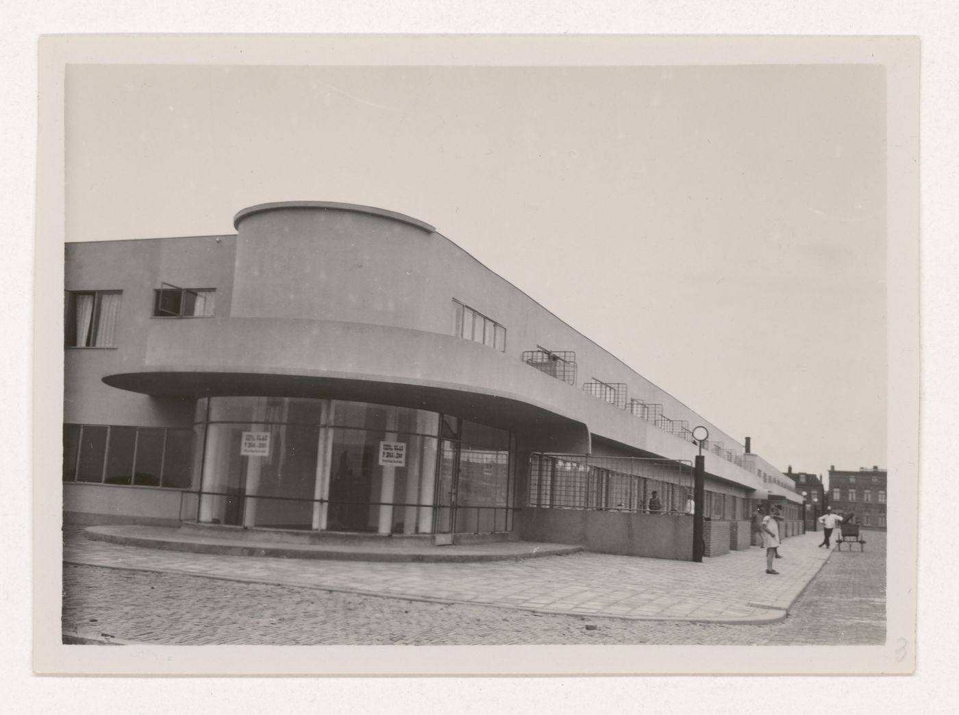 Exterior view of industrial row houses showing a corner store, Hoek van Holland, Netherlands