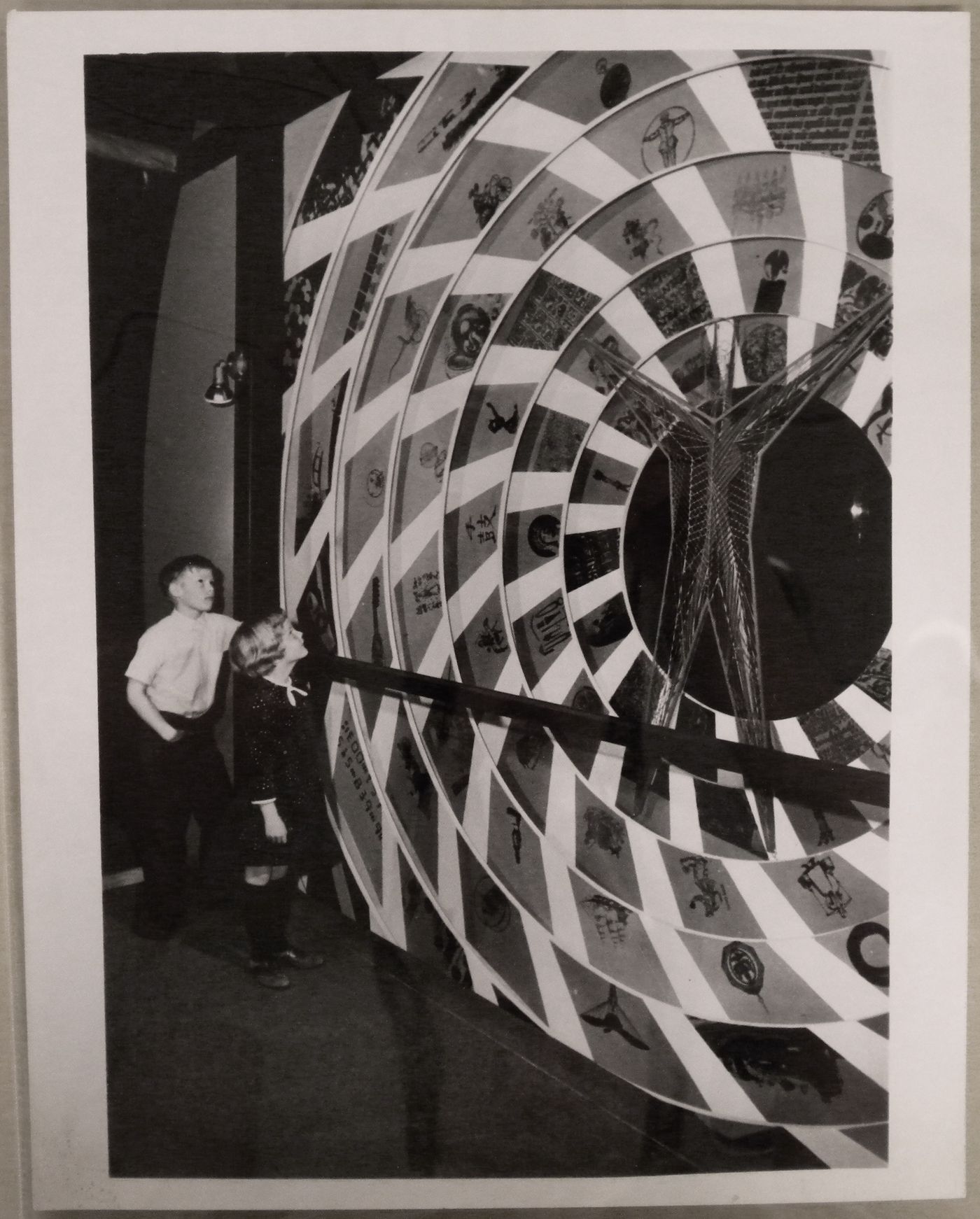 View of children looking at an unidentified artwork, Expo 67, Montréal, Québec