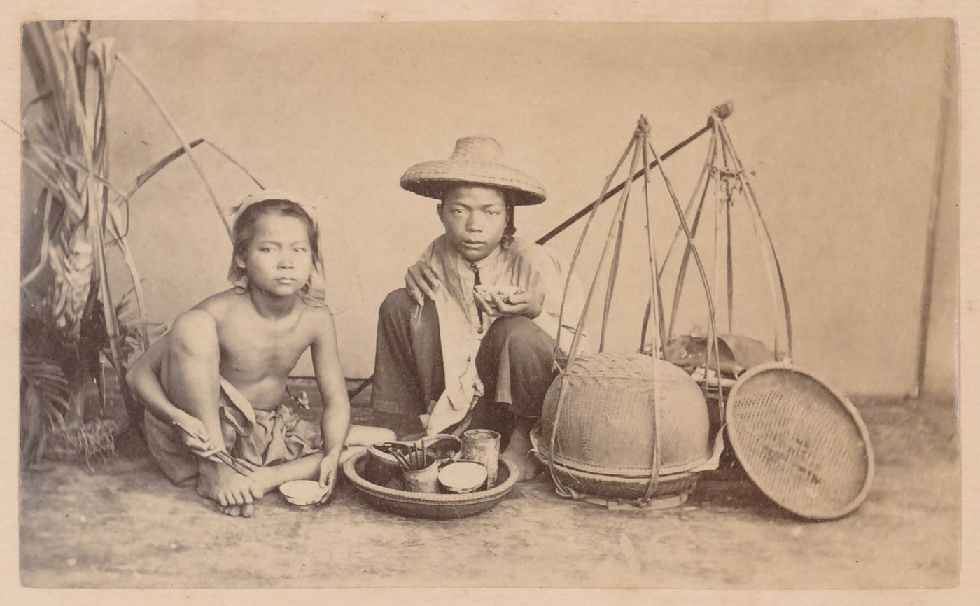 Group portrait of two boys with baskets, probably in Cochin China (now in Vietnam)