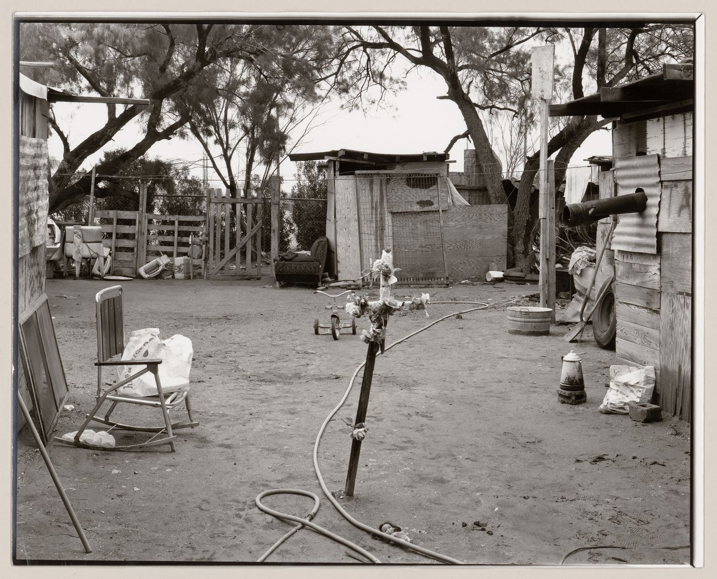 View of cross decorated with flowers in yard, Old Pascua, Tucson, Arizona, United States (from a series documenting the Yaqui community of Old Pascua)