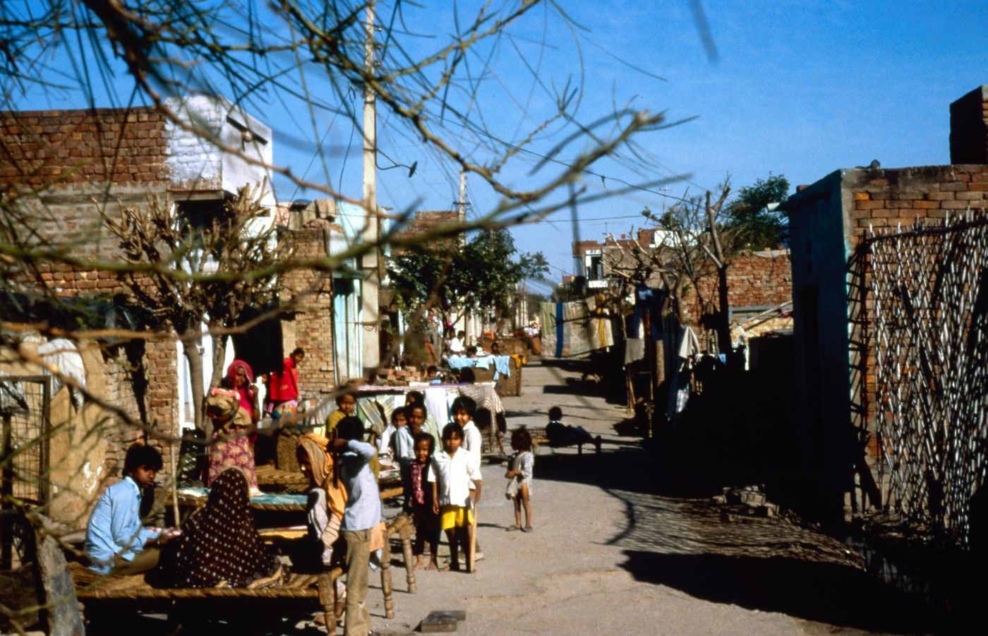 View of street with inhabitants possibly in India used for the Human Settlement Training Package "Package 1: Planning guidelines"