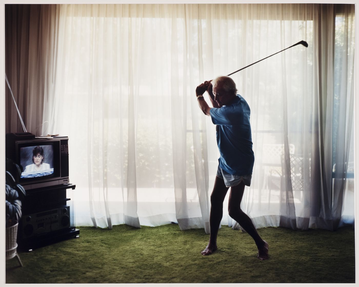 "Practicing Golf swing" from the series "Pictures From Home"