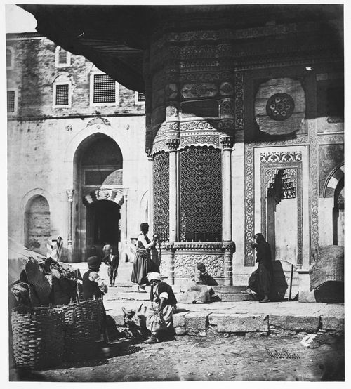Partial view of the Fountain of Sultan Ahmed III with the Imperial Gate (also known as the Bab-i Hümayun) of the Topkapi Palace in the background, Constantinople (now Istanbul), Ottoman Empire (now in Turkey)