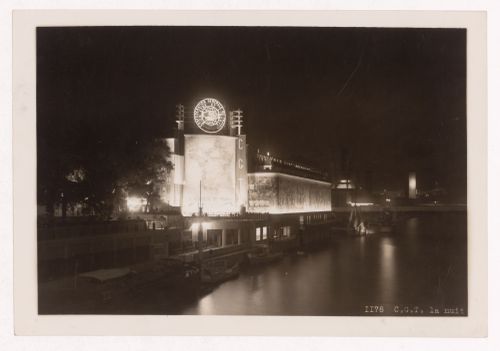Night view of the Pavillon du Travail (also known as the Palais du Travail) with the Seine in the foreground, 1937 Exposition internationale, Paris, France