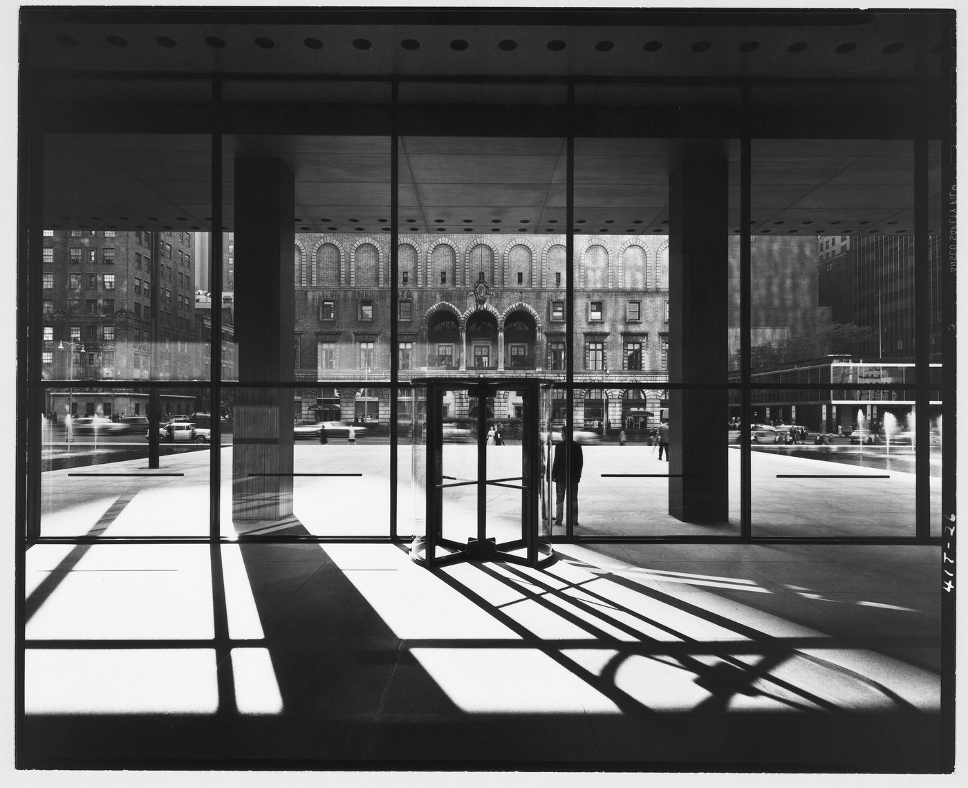 View of the plaza of the Seagram Building through a revolving glass door, New York City