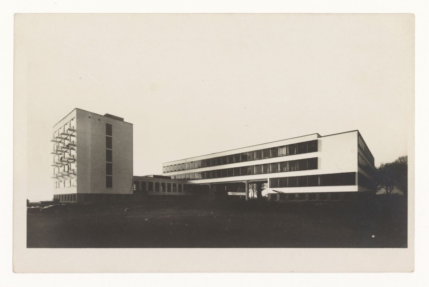 Exterior view of the Bauhaus building showing the studio wing, auditorium, cafeteria, and administration wing, Dessau, Germany