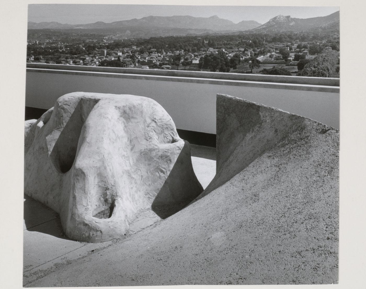 View of the roof of Unité d'habitation showing the playground and mountains in the distance, Marseille, France