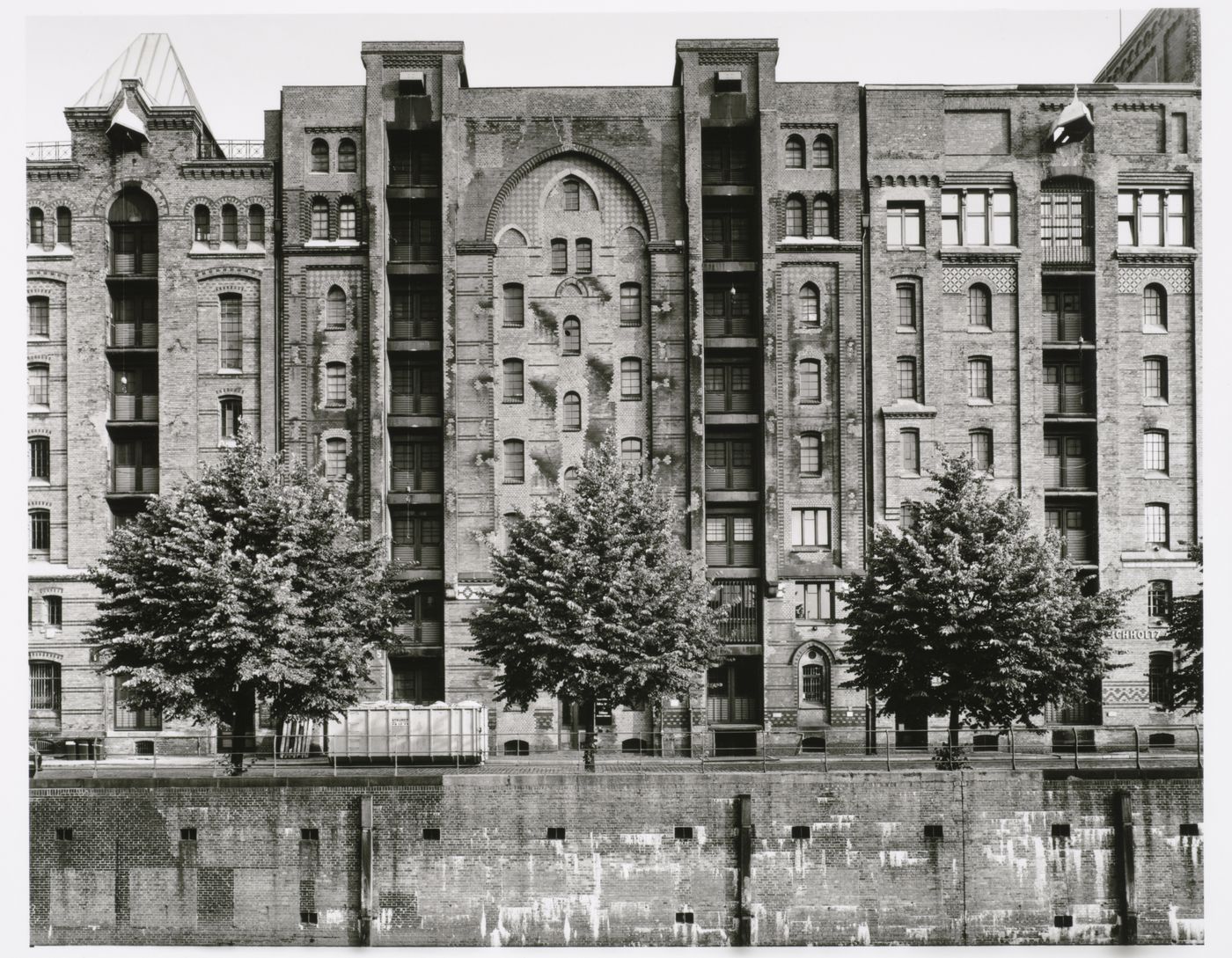 View of a Speicherblock [Storage Block] of Speicherstadt [Storage City] warehouses from across a canal, Altstadt, Hamburg, Germany
