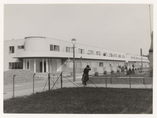 Exterior view of industrial row houses from across the street, Hoek van Holland, Netherlands