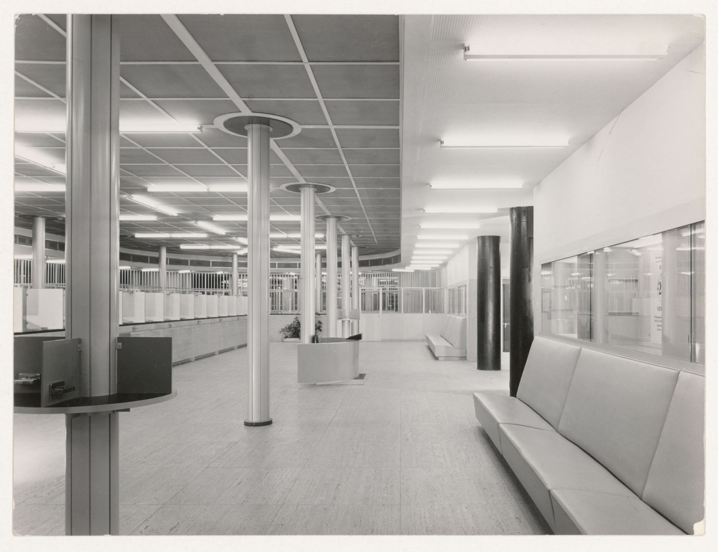 Interior view of the banking room of the Central Savings Bank showing the tellers' stations, Rotterdam, Netherlands