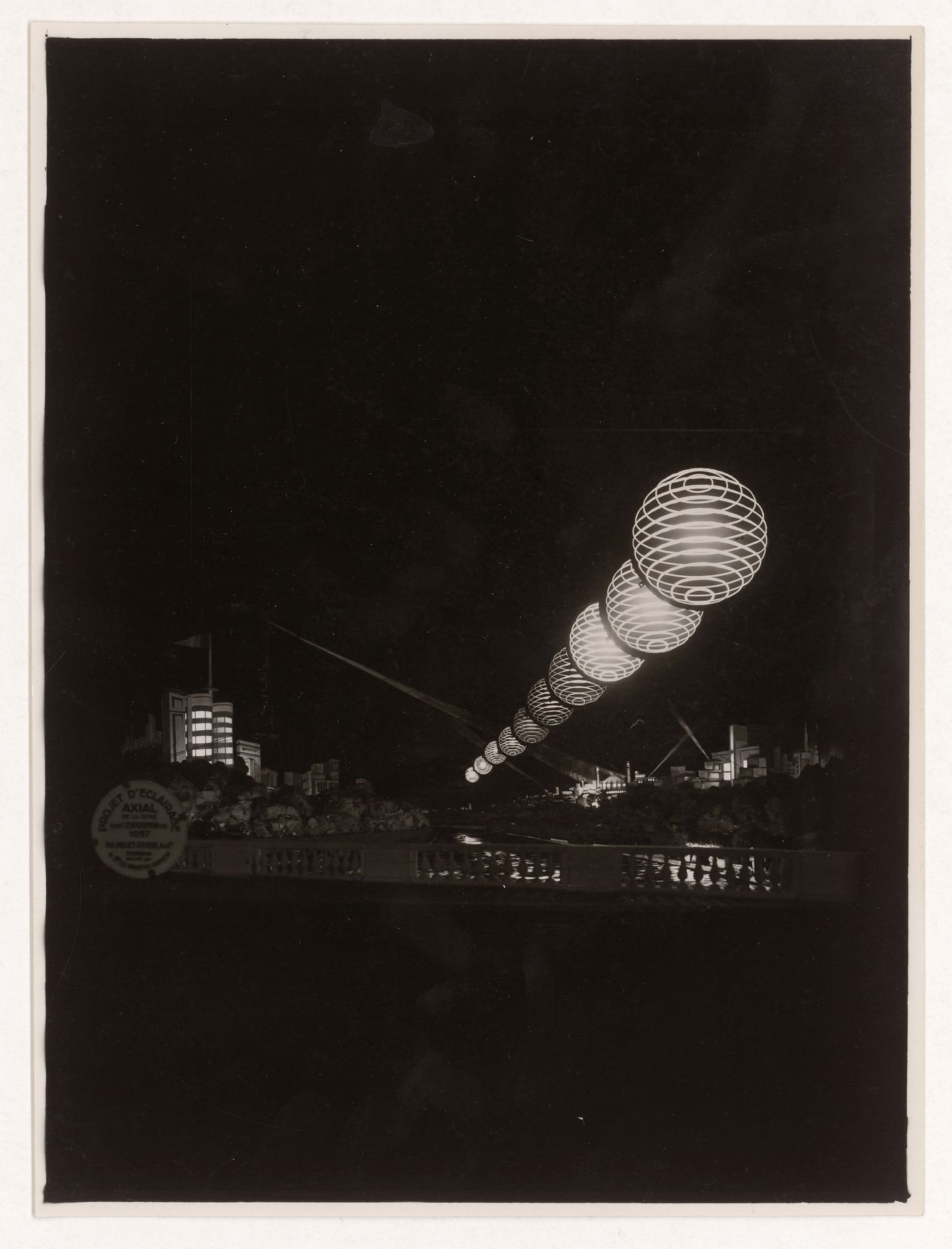 View of light exhibiton over the Seine at night for l'Exposition internationale des arts et techniques dans la vie moderne, Paris, France