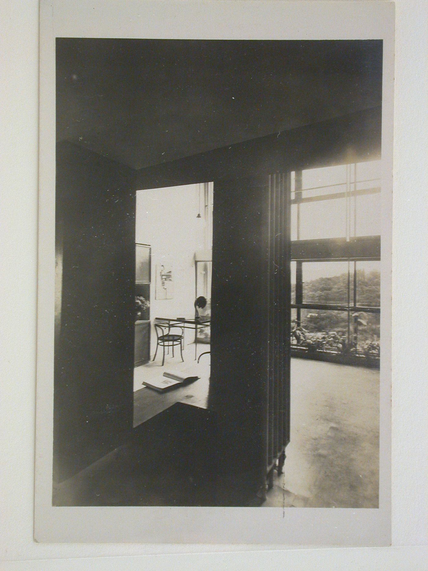Interior view of the living room of House 13 showing a table and chairs, Weissenhofsiedlung, Stuttgart, Germany