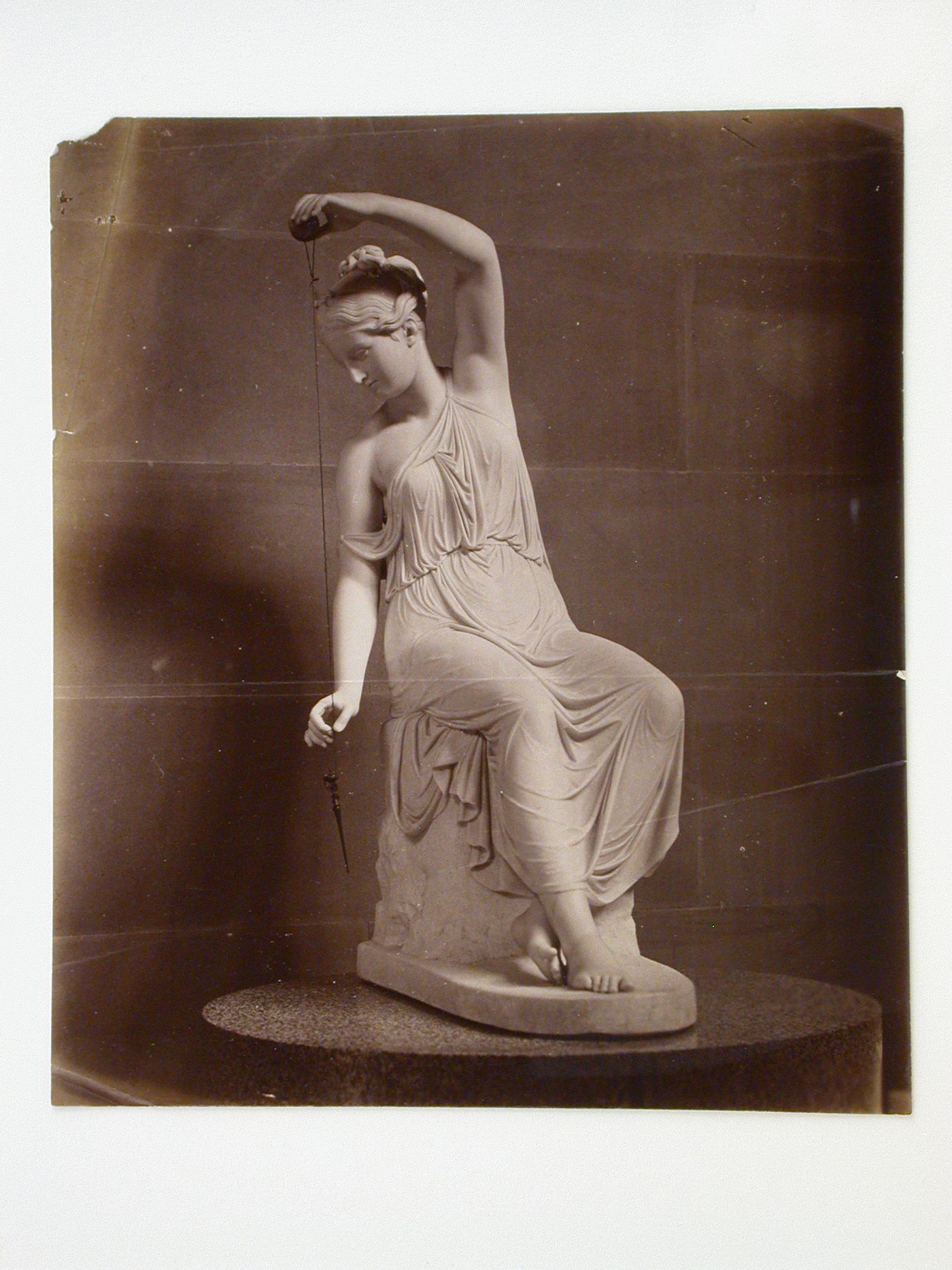 View of the marble statue "La Filatrice", the Sculpture Gallery, Chatsworth House, Derbyshire, England