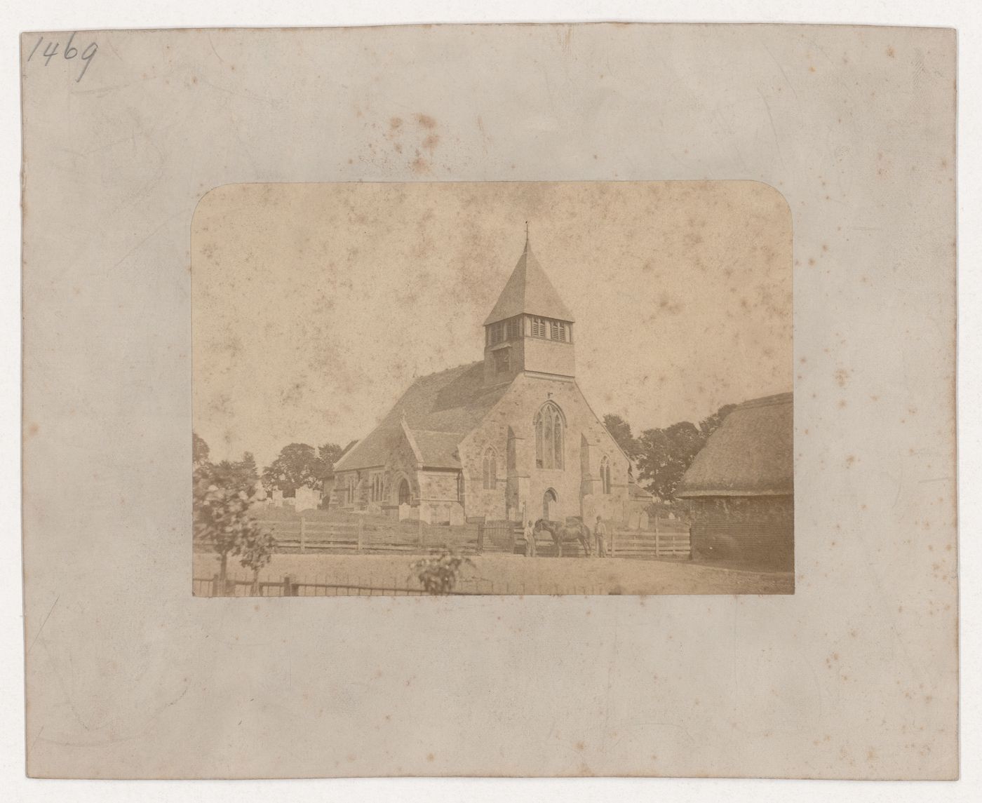 View of the west façade of the Church of All Saints taken from across a road, Whiteparish, Wiltshire, England