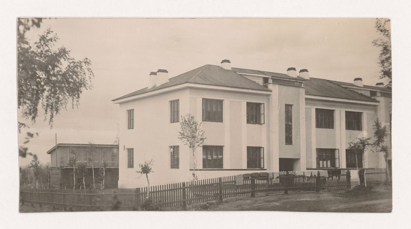 Exterior view of a two-storey house, Leninsk-Kuznetskiy, Soviet Union (now in Russia)