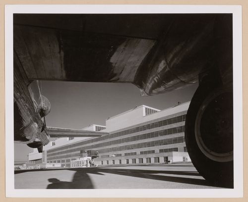 View of the rear [?] façade of the Manufacturing Building from beneath an airplane wing, Glenn L. Martin Company Bomber Plant, Omaha, Nebraska