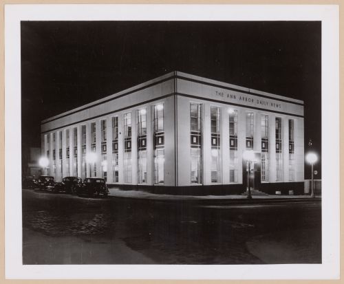 View of the principal and lateral façades of the Ann Arbour Daily News Building at night, Detroit, Michigan