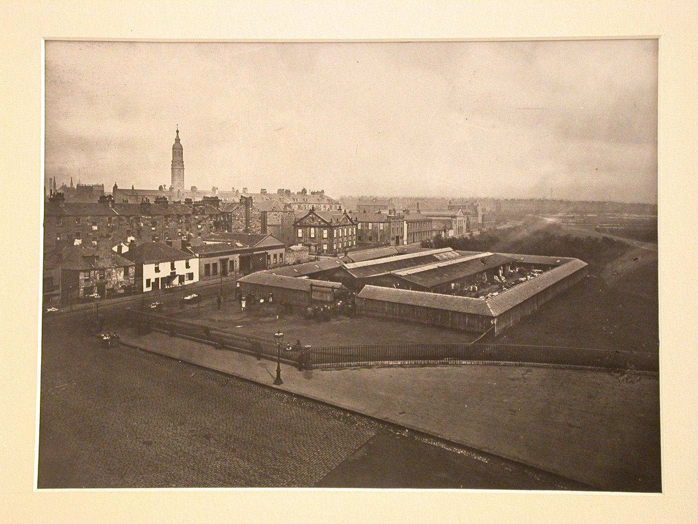 Distant view of enclosed clothes market, Glasgow in the background, Scotland