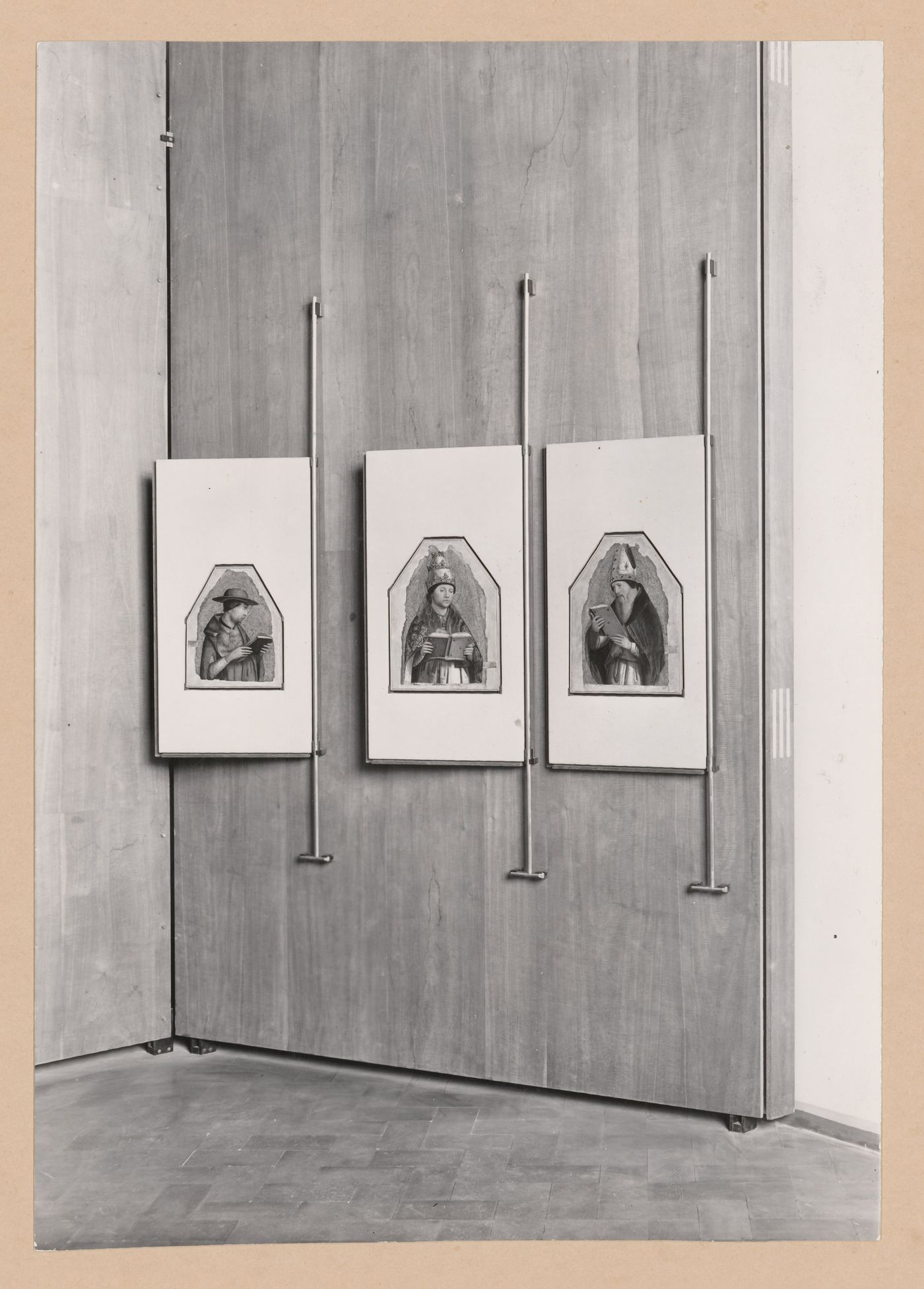 Interior view of the Salle di Antonia Messina showing three paintings hinged to the wall on the right edge of their frames, Palazzo Abatellis, Galleria regionale della Sicilia, Palermo, Italy