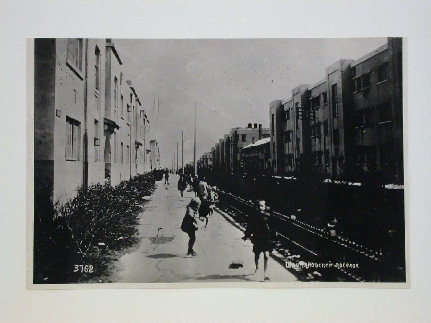 View of housing in the Armenikend (Shaumian) settlement showing a walkway and lawn, Baku, Soviet Union (now in Azerbaijan)