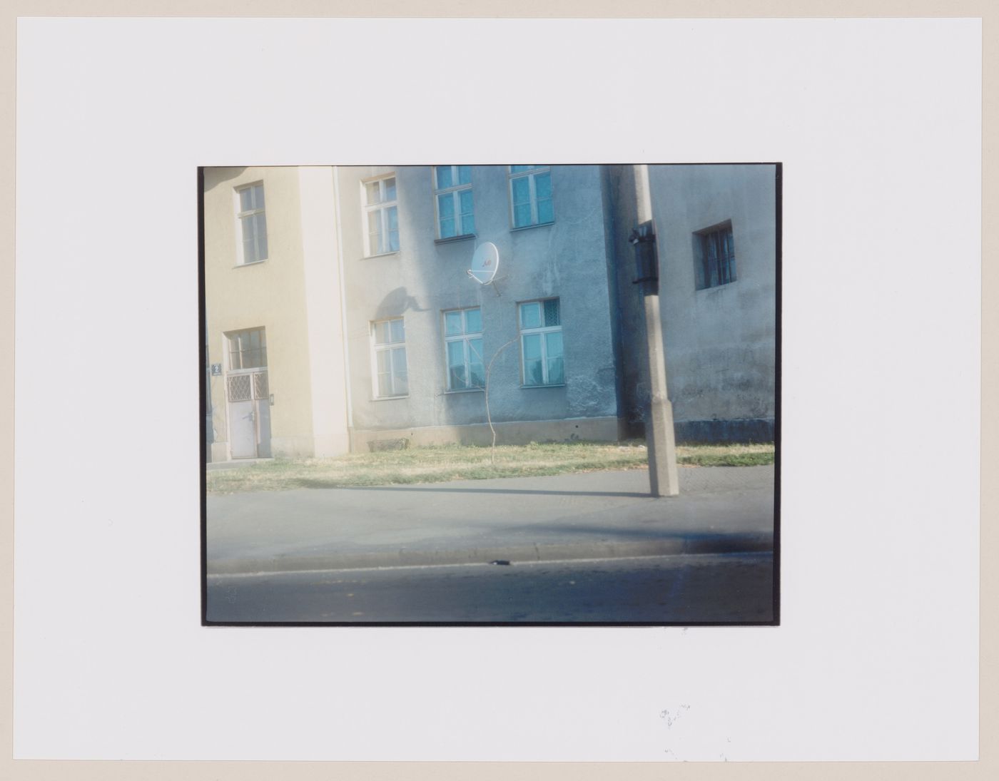 View of an apartment house showing a satellite home antenna, Gronowo, near Braniewo, Poland (from the series "In between cities")